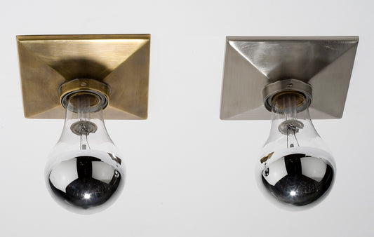 Annabelle Selldorf Escutcheon in Darkened Brass (left), and Satin Nickel (right)